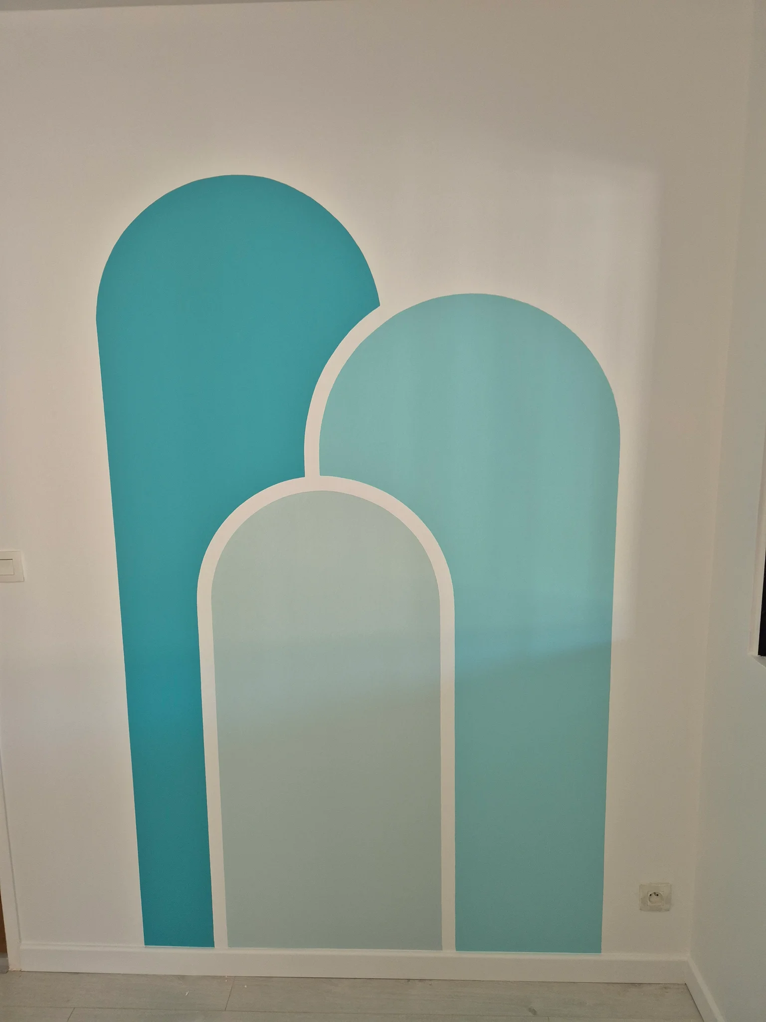 Peinture murale en arches turquoise et vert d'eau